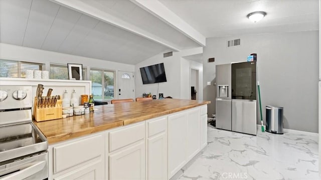 kitchen featuring white cabinets, vaulted ceiling with beams, butcher block countertops, and stainless steel electric range