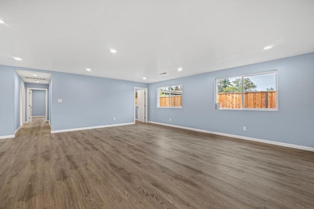 spare room featuring dark hardwood / wood-style floors