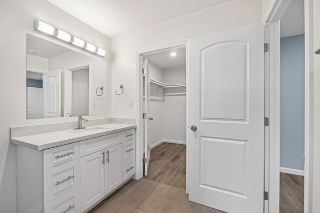 bathroom with vanity and hardwood / wood-style floors