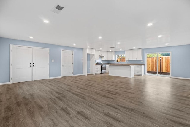 unfurnished living room with hardwood / wood-style floors