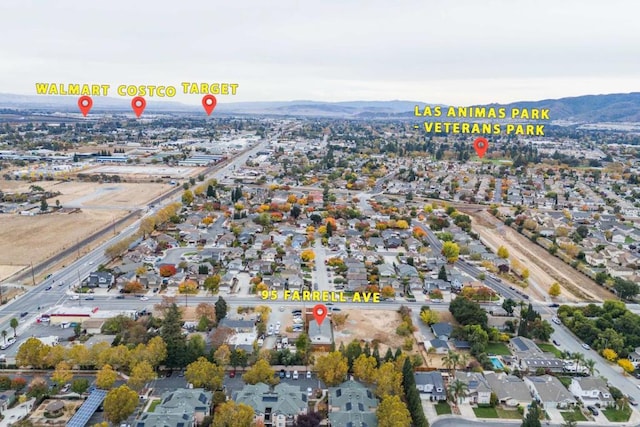 birds eye view of property featuring a mountain view