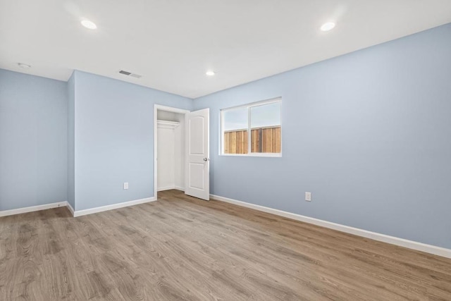 unfurnished room featuring light hardwood / wood-style flooring