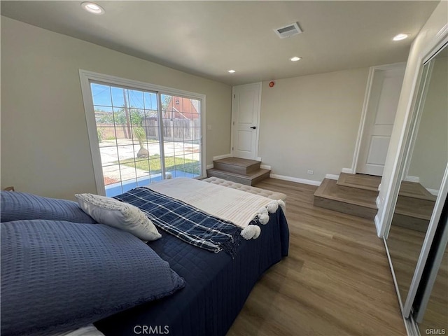 bedroom with hardwood / wood-style flooring