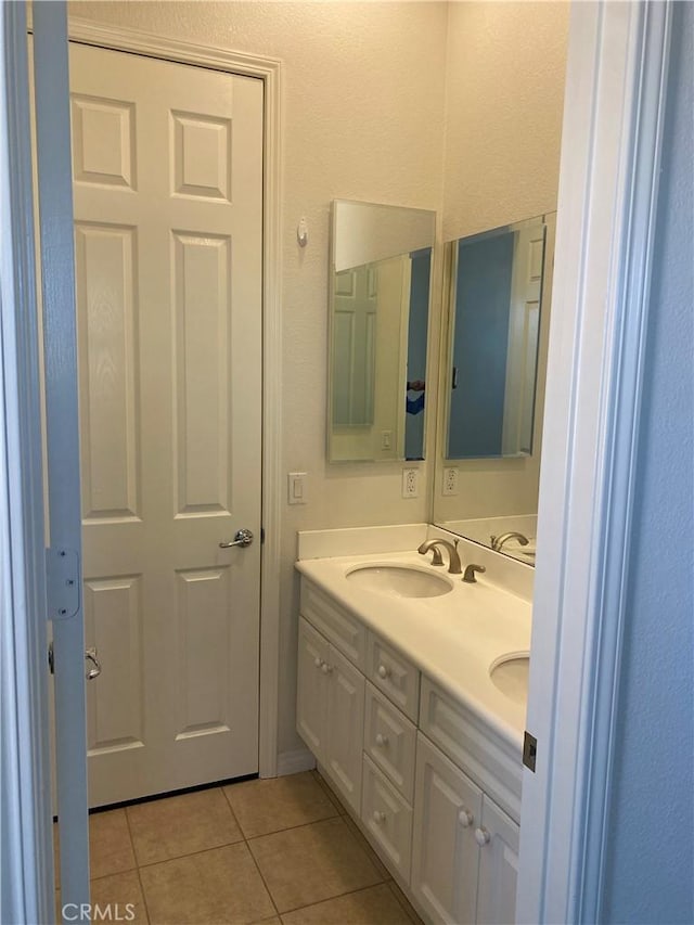 bathroom featuring tile patterned floors and vanity