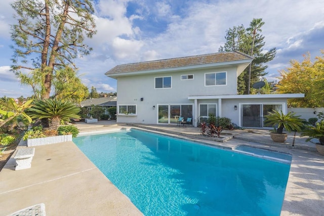 rear view of house with a patio