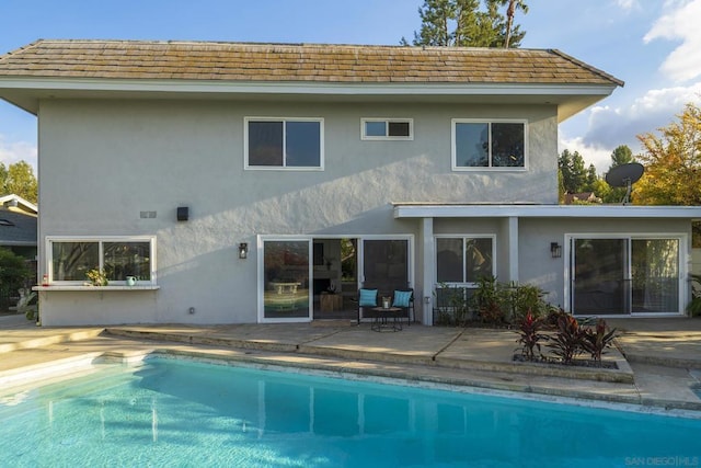 back of property with a patio area