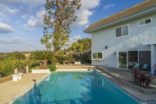 view of pool featuring a patio area