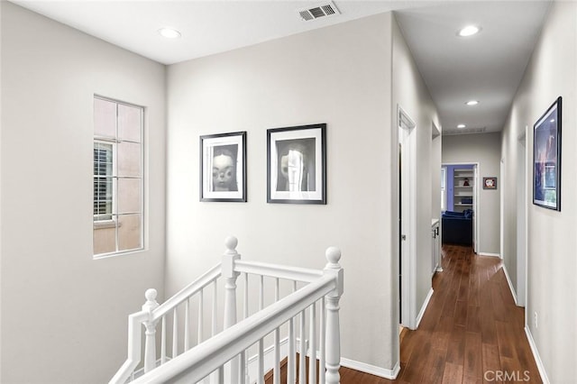 corridor featuring dark hardwood / wood-style floors