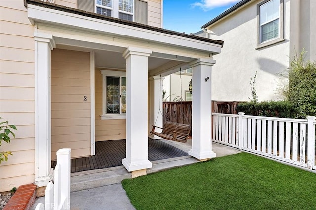 property entrance with covered porch