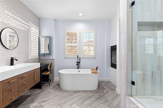 bathroom with vanity, separate shower and tub, and parquet floors