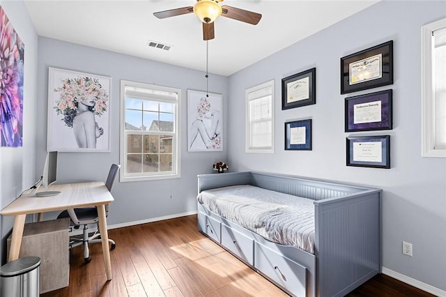 bedroom featuring dark hardwood / wood-style floors and ceiling fan