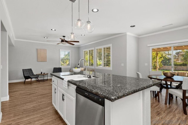 kitchen featuring wood-type flooring, white cabinetry, sink, a kitchen island with sink, and stainless steel dishwasher