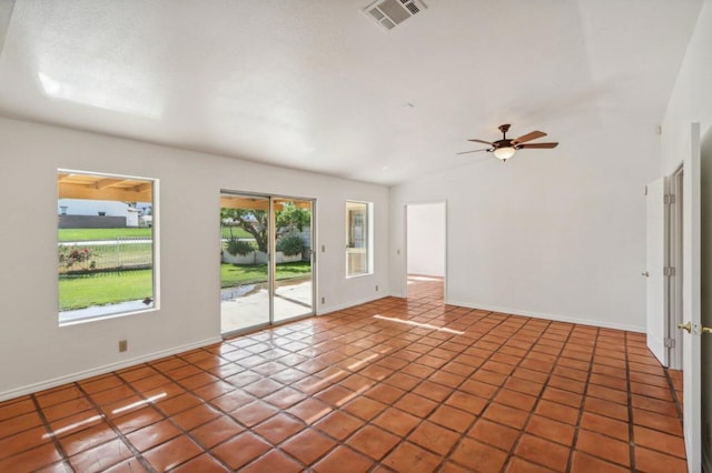 spare room featuring tile patterned flooring, lofted ceiling, and ceiling fan