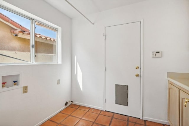 laundry room with light tile patterned flooring and hookup for a washing machine