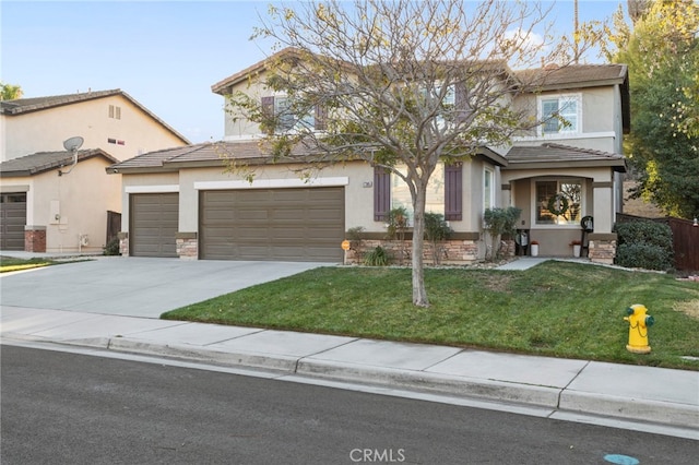 view of front facade with a garage and a front yard