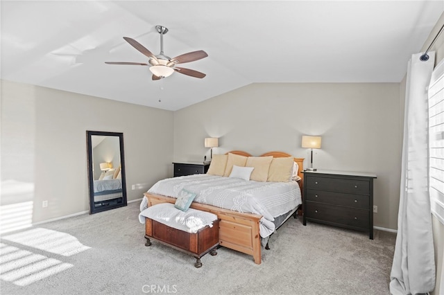 carpeted bedroom featuring ceiling fan and vaulted ceiling