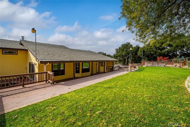 exterior space with a yard and a wooden deck