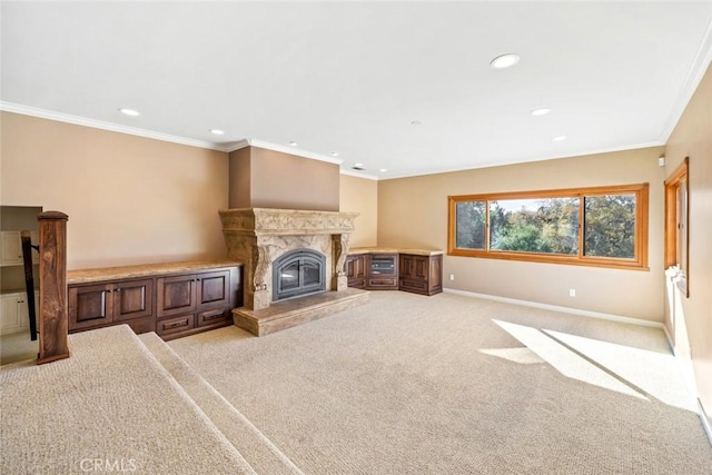 unfurnished living room with a fireplace, ornamental molding, and light carpet