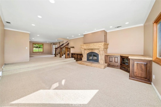 living room featuring light carpet, crown molding, and a premium fireplace