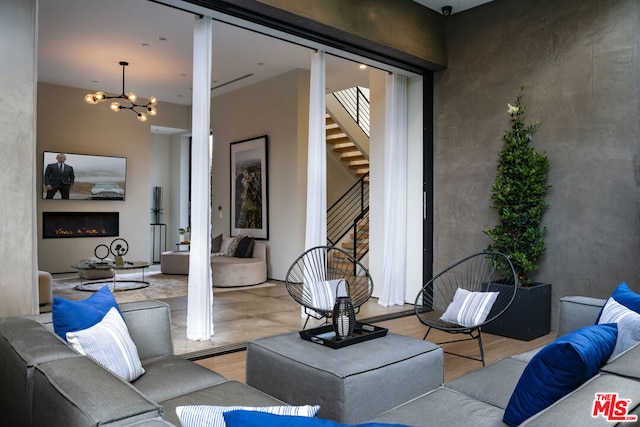 view of patio / terrace with an outdoor living space with a fireplace