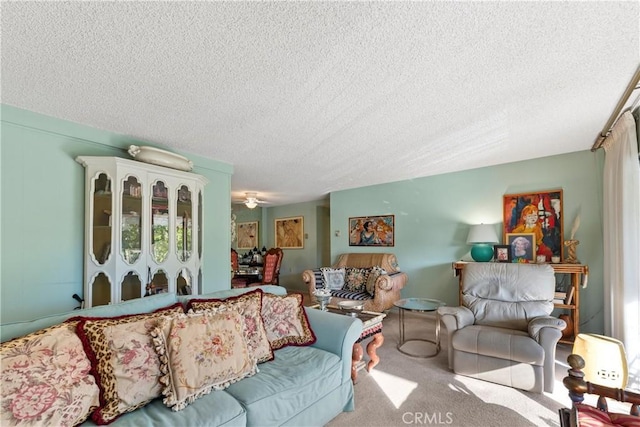 carpeted living room with a textured ceiling