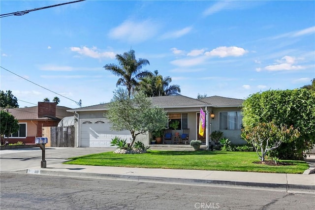 single story home with a front yard and a garage