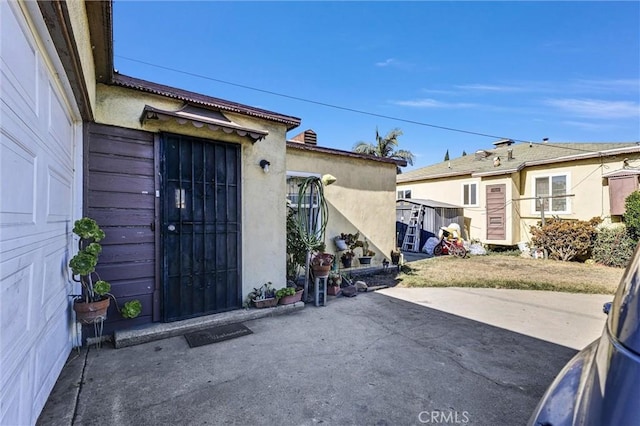 doorway to property featuring a patio