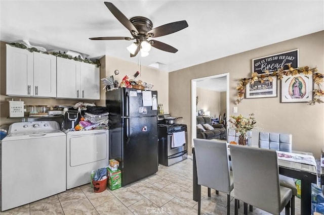 kitchen with ceiling fan, independent washer and dryer, stainless steel gas range, black refrigerator, and white cabinets