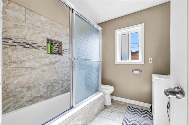 bathroom with toilet, shower / bath combination with glass door, and tile patterned flooring