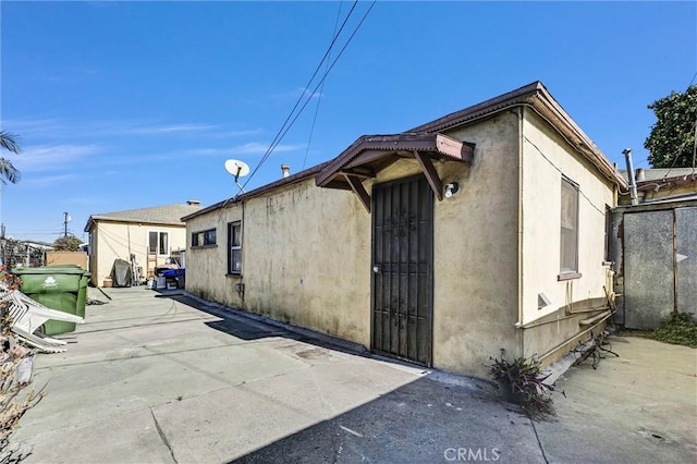 view of home's exterior with a patio area