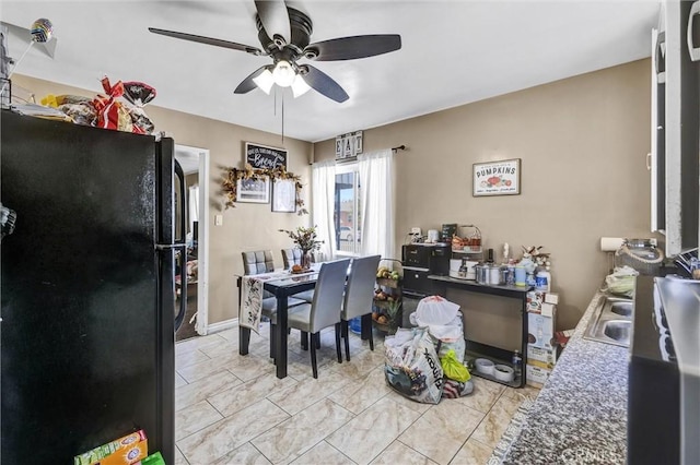 dining space featuring ceiling fan