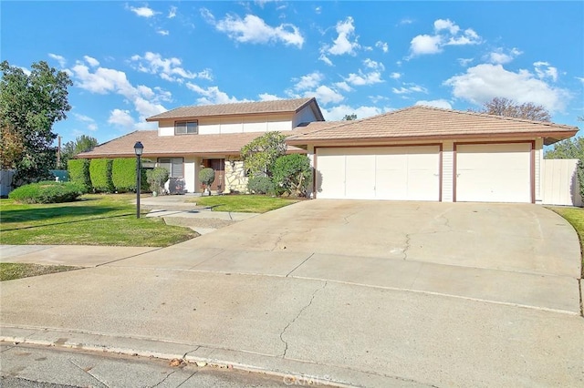 view of front facade with a garage and a front yard