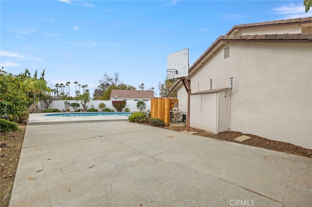 view of patio / terrace featuring a fenced in pool