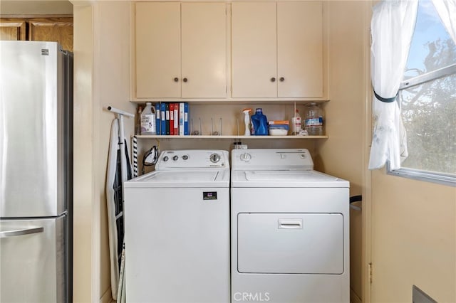 clothes washing area featuring independent washer and dryer