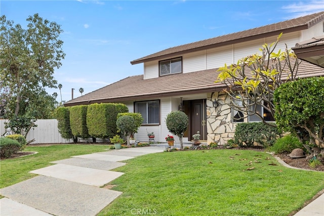 view of front of home with a front lawn