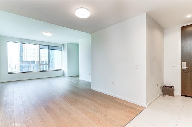 unfurnished room featuring light hardwood / wood-style flooring