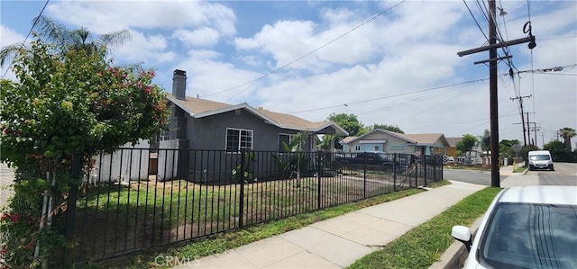 view of side of home featuring a lawn