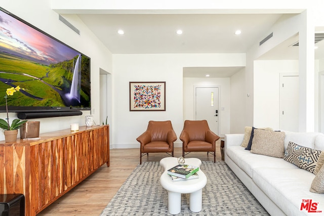 living room with light hardwood / wood-style floors