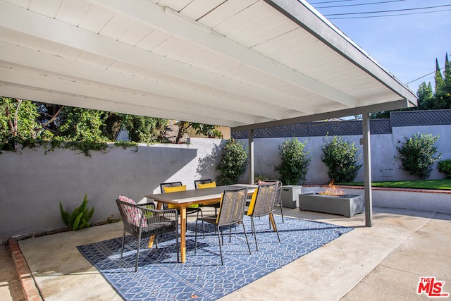 view of patio / terrace featuring an outdoor fire pit