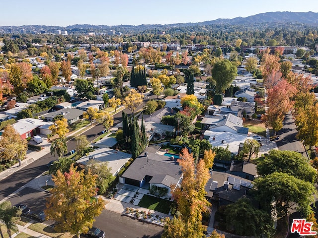 birds eye view of property featuring a mountain view