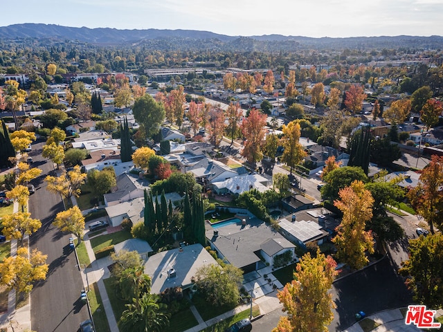 birds eye view of property with a mountain view