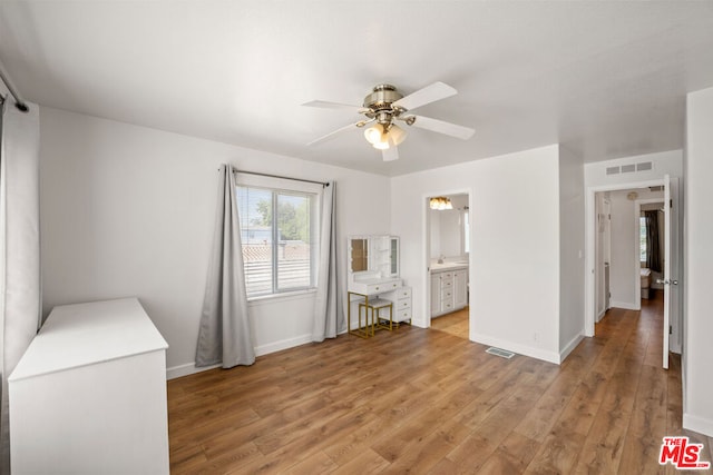 unfurnished room featuring ceiling fan and light hardwood / wood-style flooring