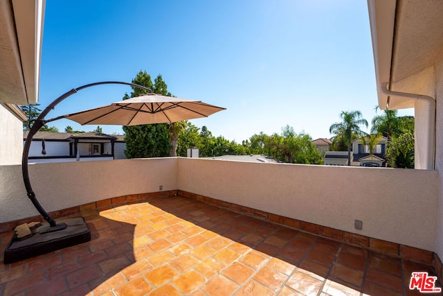 view of patio with a balcony