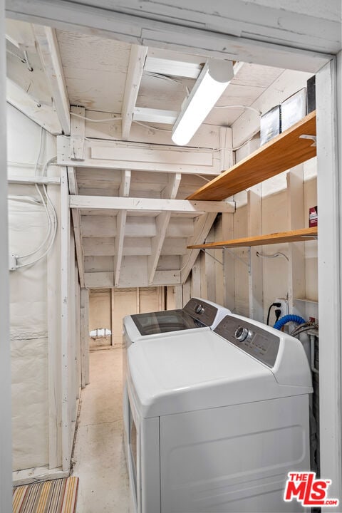 laundry room featuring washing machine and dryer