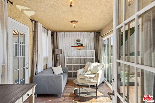 sunroom featuring french doors