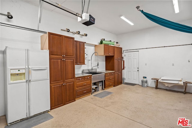 kitchen with white refrigerator with ice dispenser