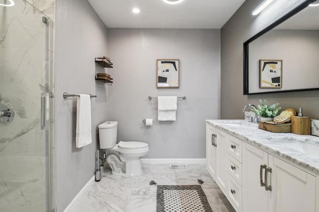 bathroom with vanity, an enclosed shower, and toilet