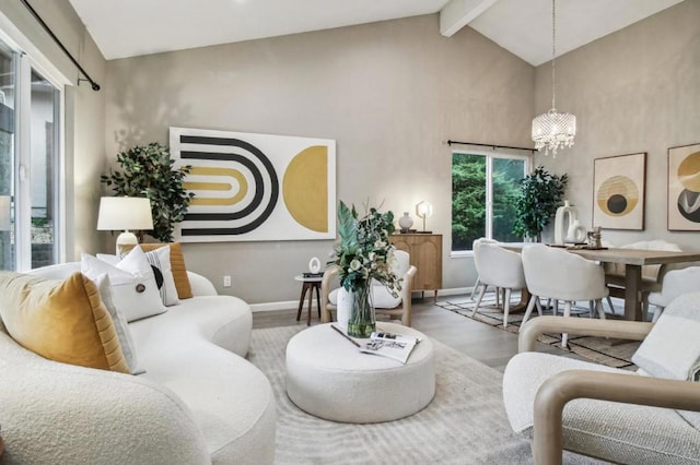 living room with vaulted ceiling with beams, a notable chandelier, and hardwood / wood-style flooring