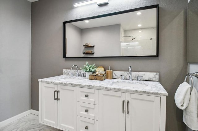 bathroom featuring vanity and a shower