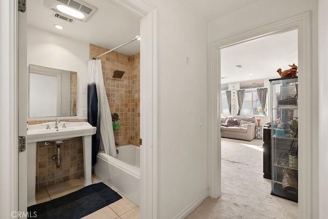 bathroom with shower / bathtub combination with curtain